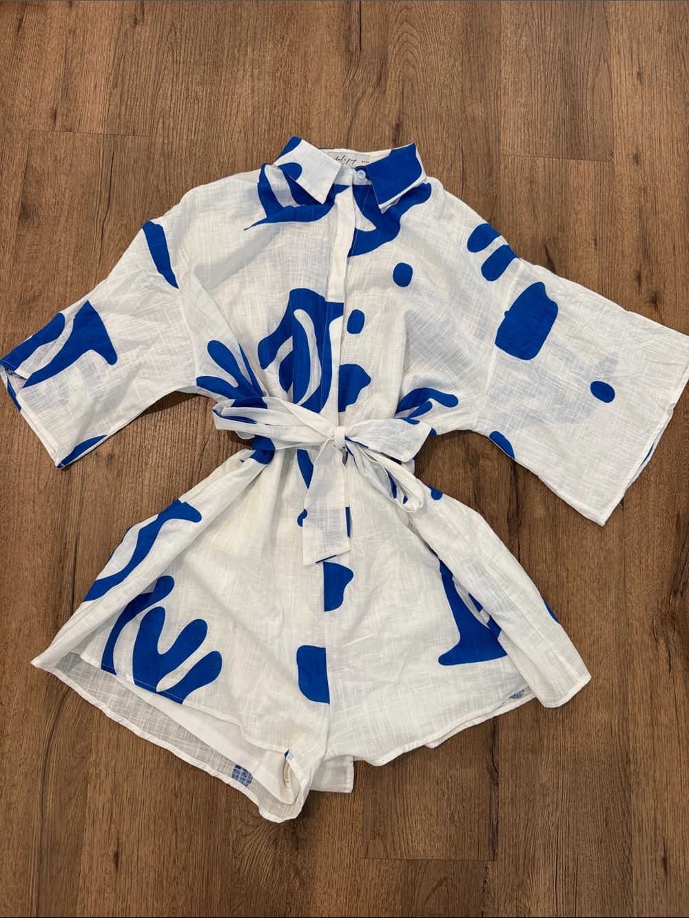 Petal & Pup White Button-Front Romper with Bold Blue Abstract Shapes